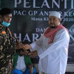 Banser Kokop Terima Tongkat Komando Dari Rois MWCNU